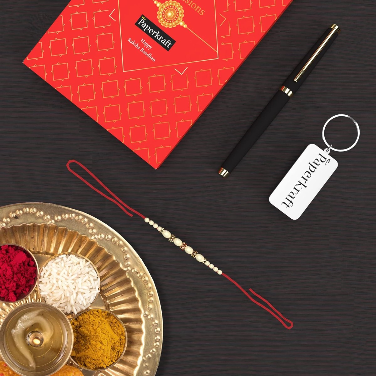 Paperkraft Expressions Gift Set - 1 Ceramic Roller ball Metal Pen with Gold trims 0.6 mm Stainless Steel Tip + 1 Stainless Steel Key Chain + 1 Free* Rakhi Band